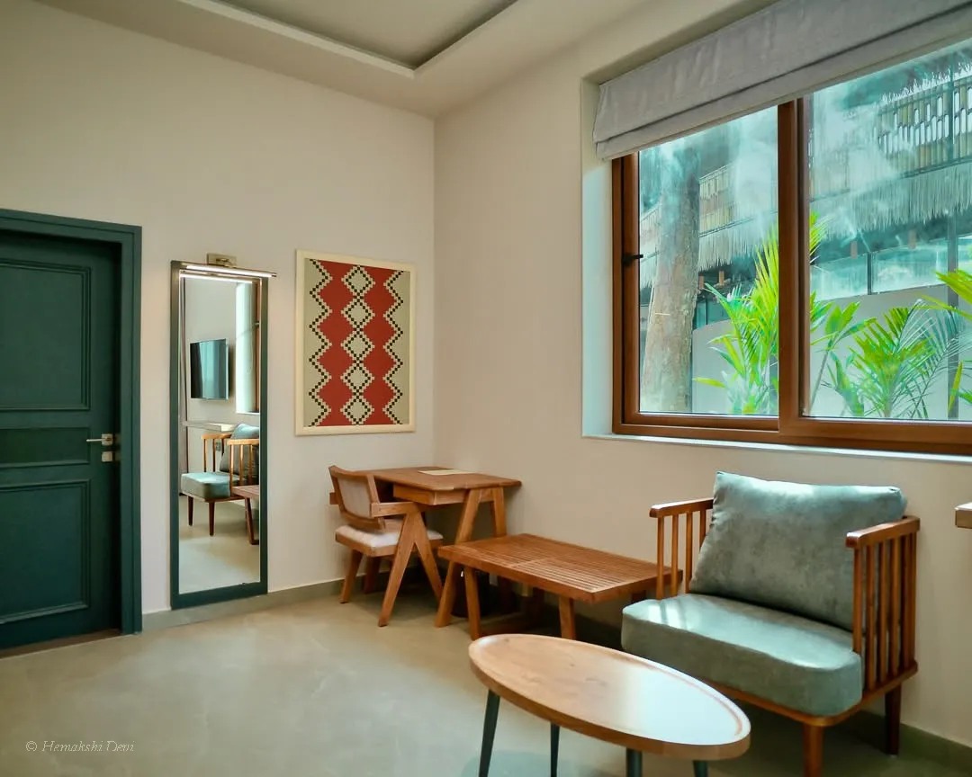 Guest lounge with a framed woven-pattern digital artwork on the wall